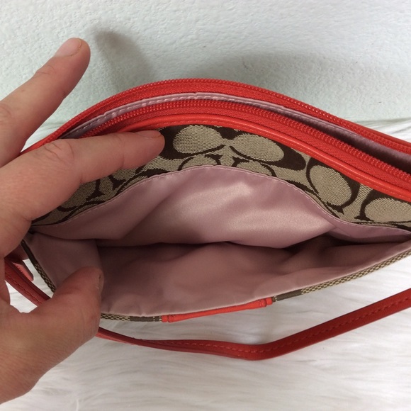 Coach logo wristlet accented with a deep orange. - Picture 4 of 7